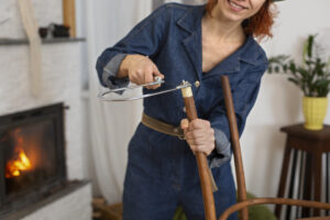 front view woman restoring wooden furniture